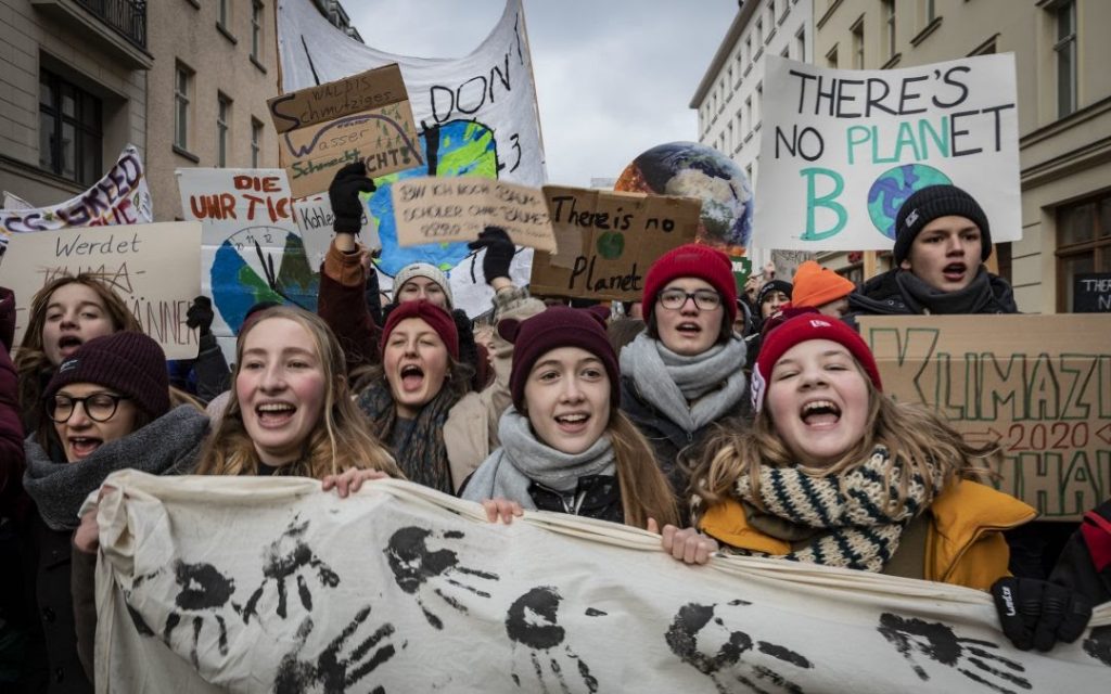 Young environmental activists protesting outside